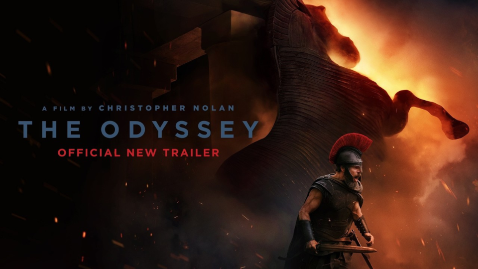 Matt Damon as Odysseus in armor before the burning Trojan Horse