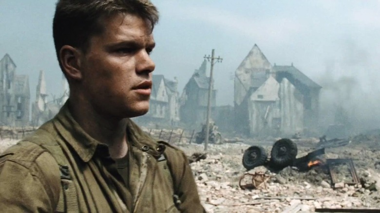 Matt Damon as Private Ryan standing in a destroyed French town